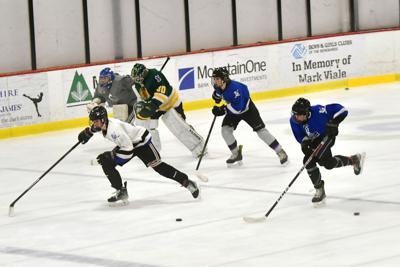 Hockey players do drills during practice