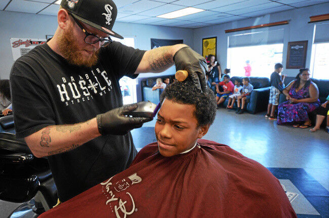 Sim's Barbershops provide free haircuts and styling sessions for that fresh back-to-school look