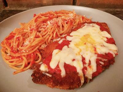 Chicken Parmesan and spaghetti on a plate