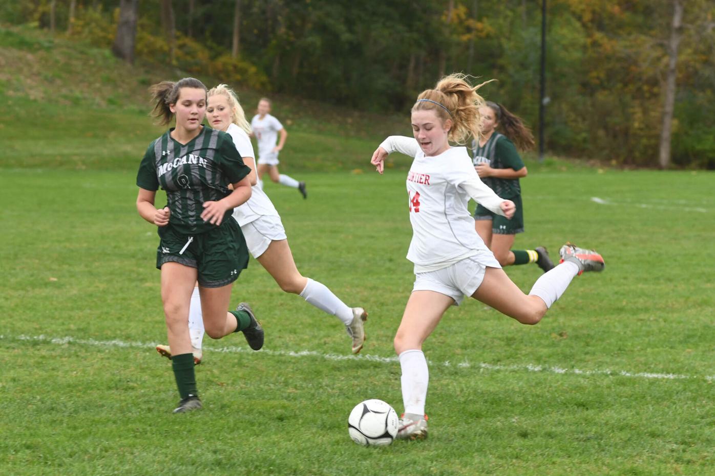 Two players fight for the ball