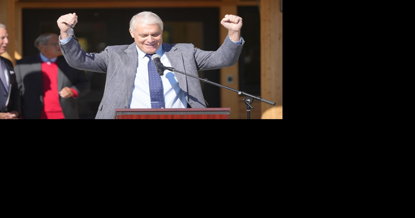John Duval speaks at podium