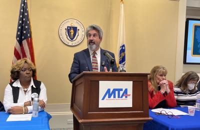 Man speaks at podium