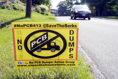 A lawn sign opposing a PCB dump site