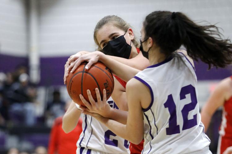 taylor garabedian and randi duquette fight for basketball in game