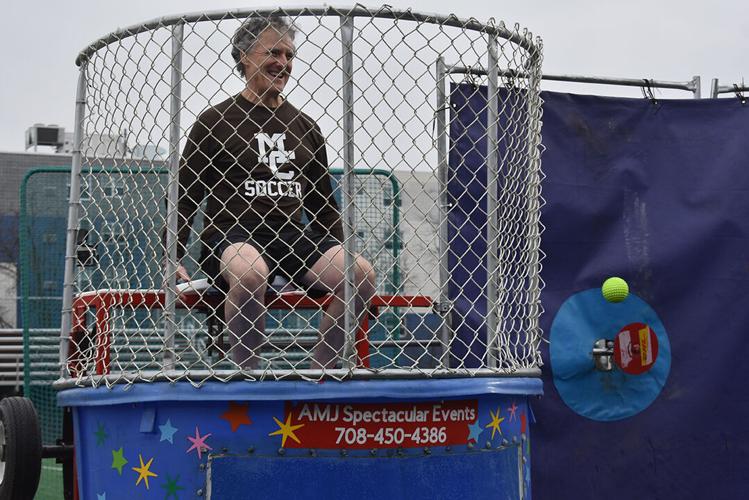 Teachers brave the dunk tank on Disability Awareness Day to raise money for  senior heading for the Special Olympics World Games – AAPS District News