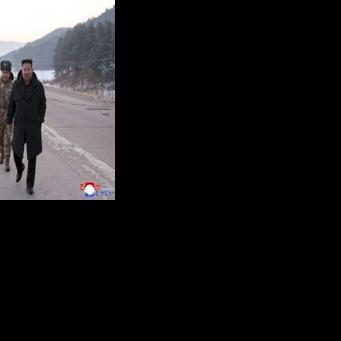This picture released by North Korea's official Korean Central News Agency (KCNA) shows North Korean leader Kim Jong Un (R) inspecting a missile launch exercise in Pyongyang