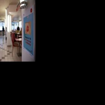 Diners have lunch at a university restaurant in France, where students get one-euro meals