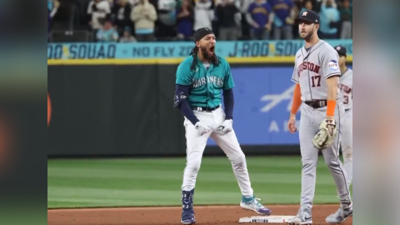 J.P. Crawford of the Seattle Mariners scores a run on a double by