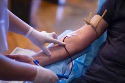 Blood donation hand. Nurse hands