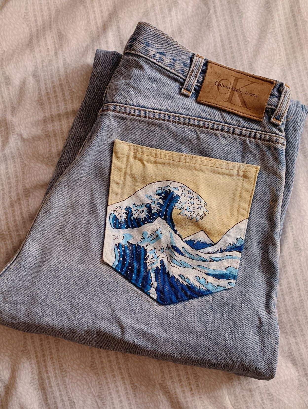 fire painting on jeans