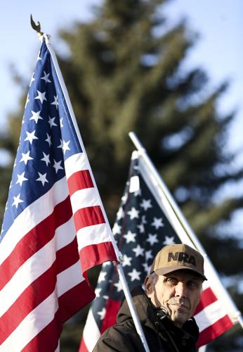 Steve Forsmann rests his American flag on his shoulder