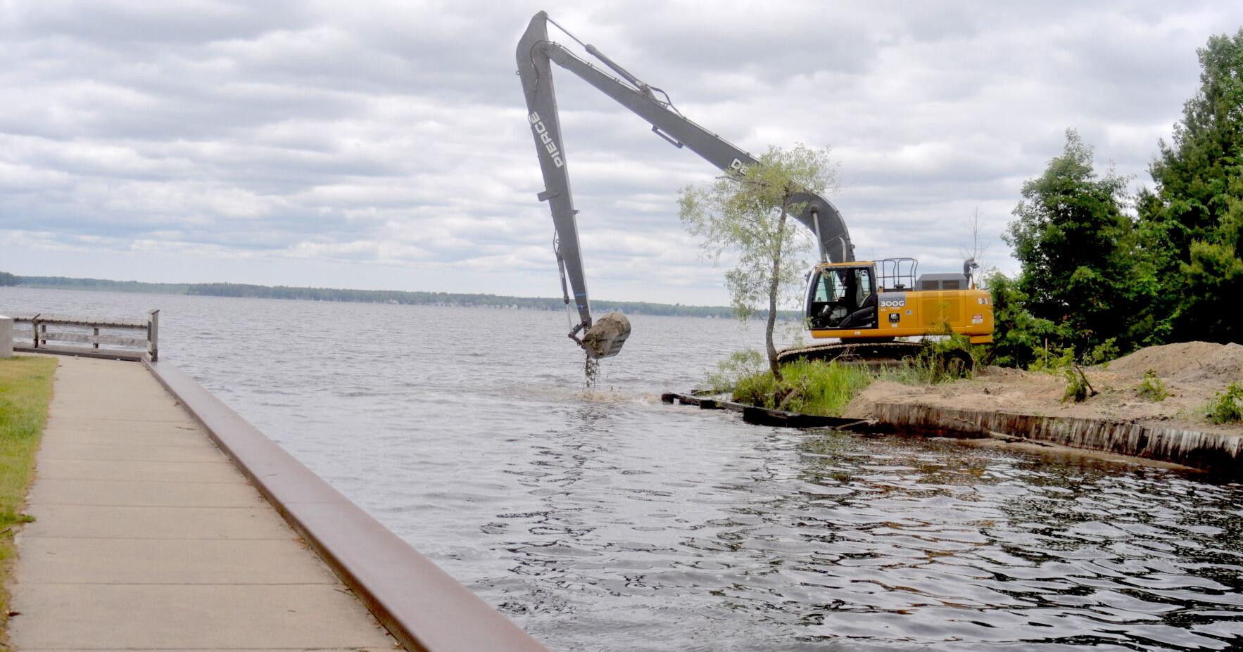 DNR dredging sand from Lake Mitchell side of canal - Vimarsana News