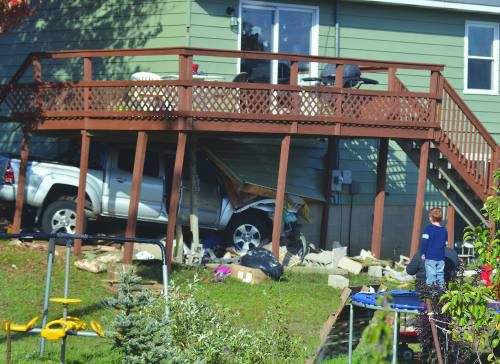 Woman Hurt When Pickup Crashes Into House | Local News | Cadillacnews.com