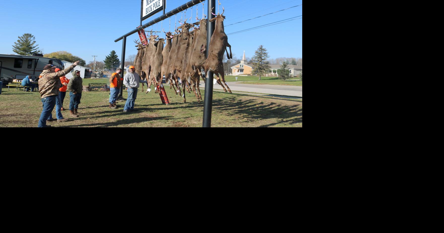 Local hunters hang their harvests at local buck poles News