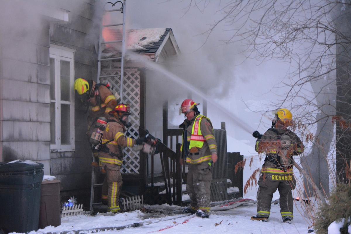Crews battle house fire in Cadillac