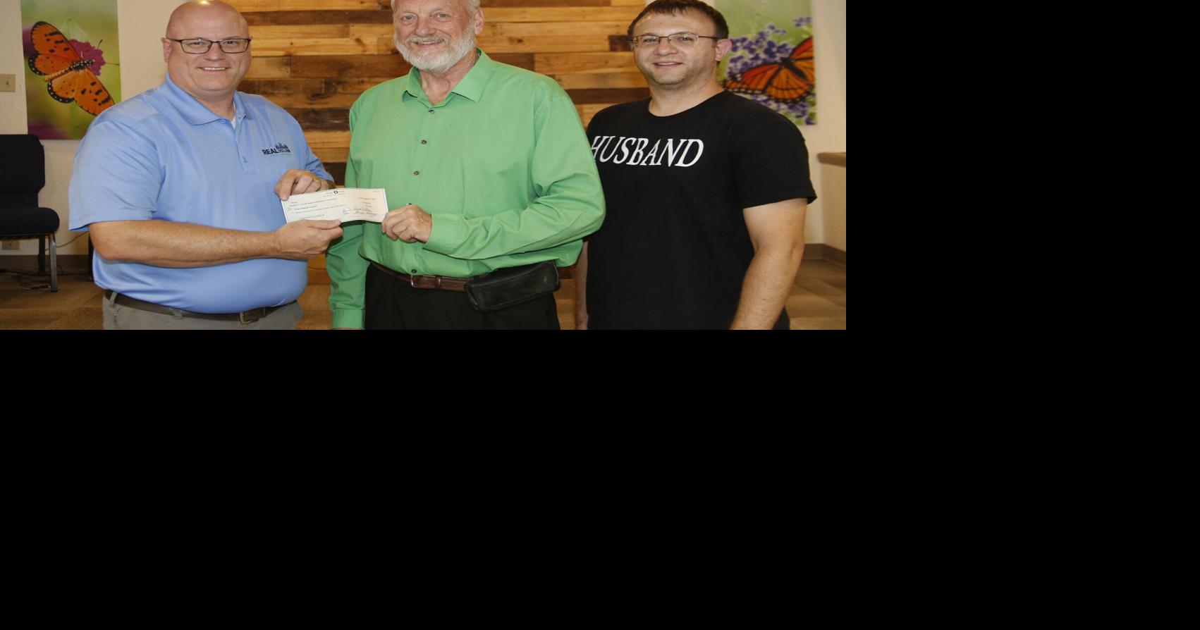 REAL 102 donates remaining funds to Grace Baptist’s station