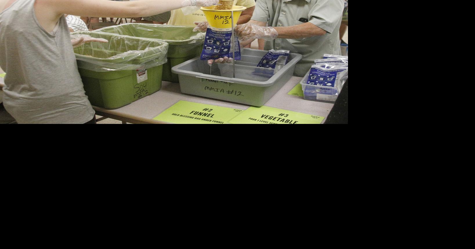 Churches’ meal-packing event lifts spirits, souls