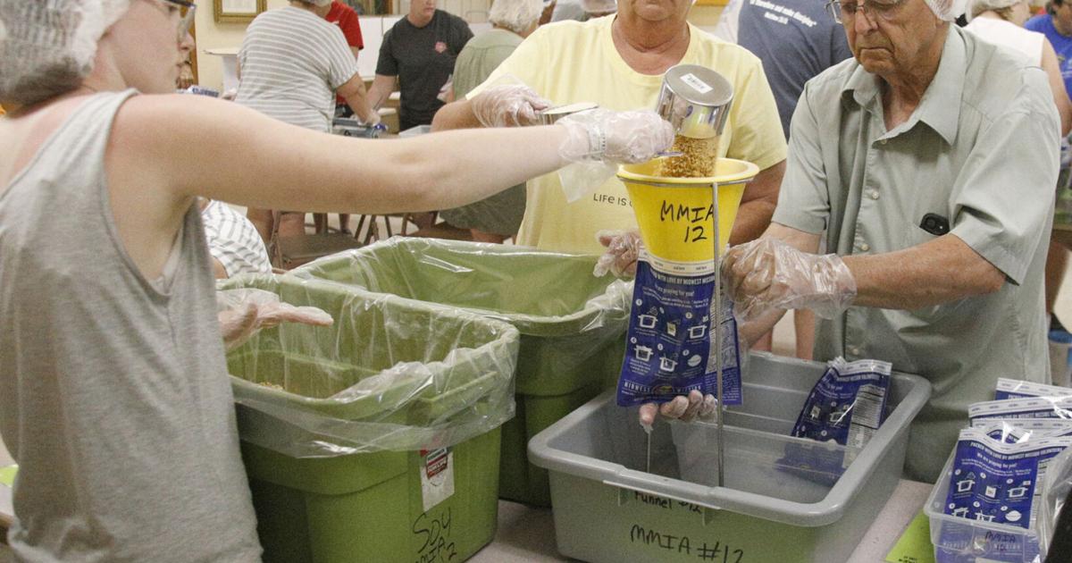 Churches’ meal-packing event lifts spirits, souls