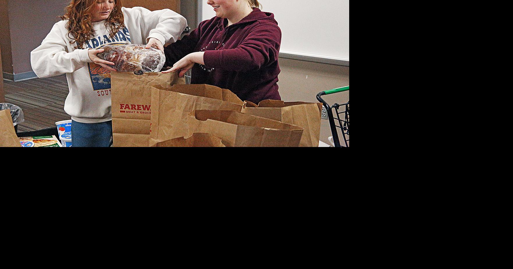 CHS students help fill tables with Adopt-a-Family Thanksgiving meals ...