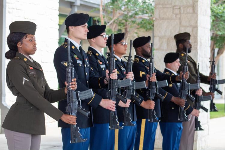 Memorial day. A female soldier in uniform salutes against the