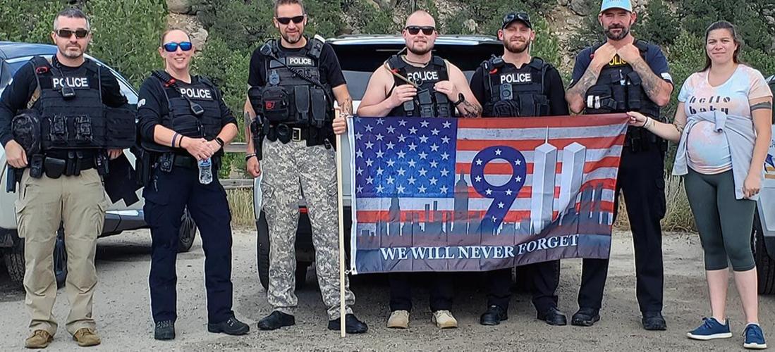 Officers pose with 9/11 remembrance flag