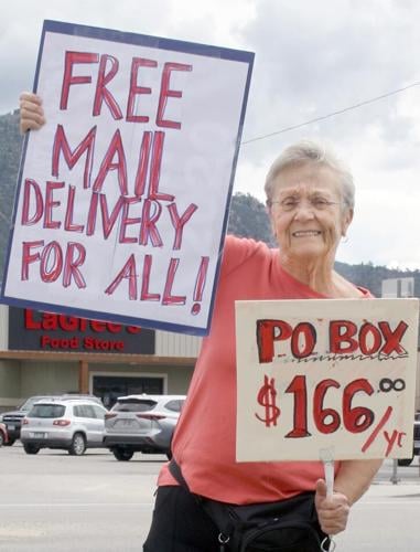 Mary Ann Uzelac protests the cost of forced post office box rentals