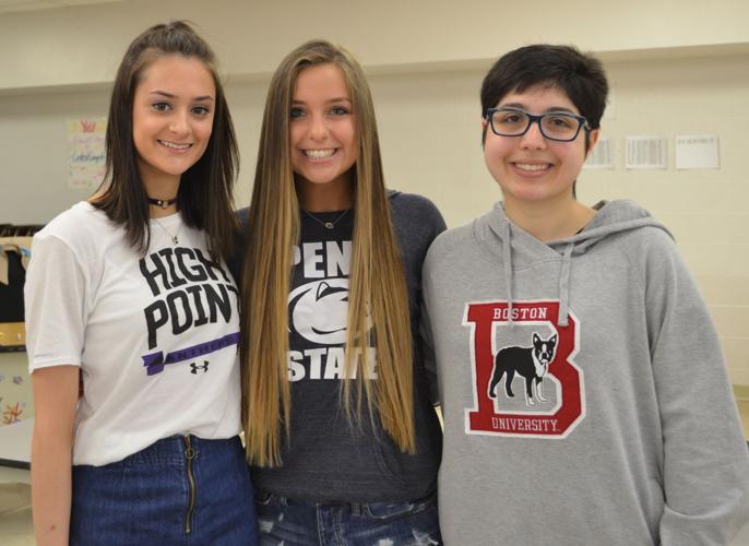 Students show their new colors on College Signing Day Solon