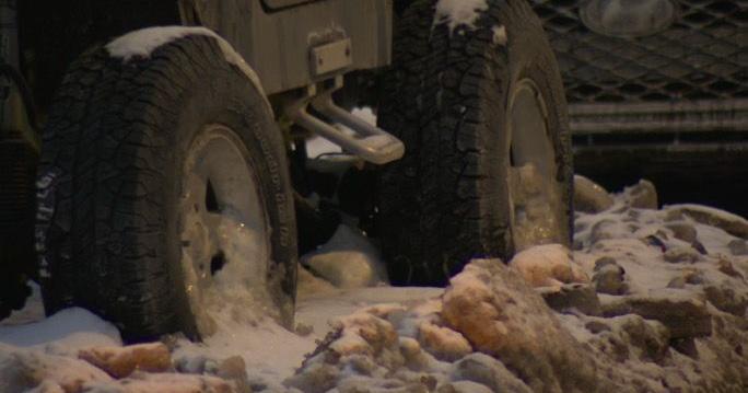 Ongoing water main break turns Cleveland street into ice, stranding cars