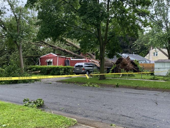 PHOTOS: Severe storm topples trees, knocks out power to thousands ...