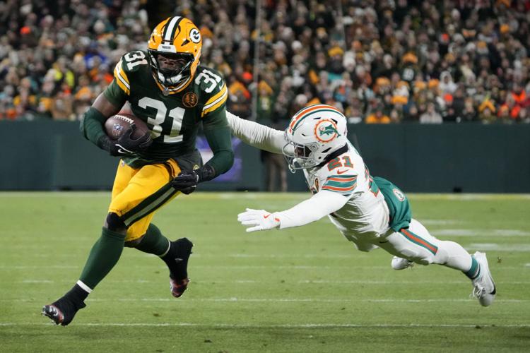 Love connects with Reed on 2 TDs as Packers use fast start to beat
