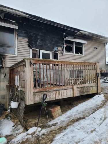Burnt siding on Judy Elliott's home.jpg