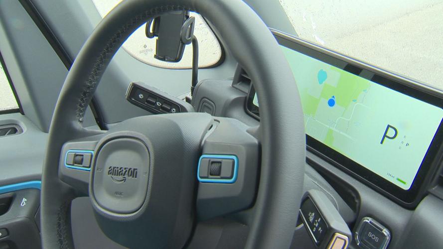 Behind the wheel of the Amazon electric delivery vehicle.jpeg
