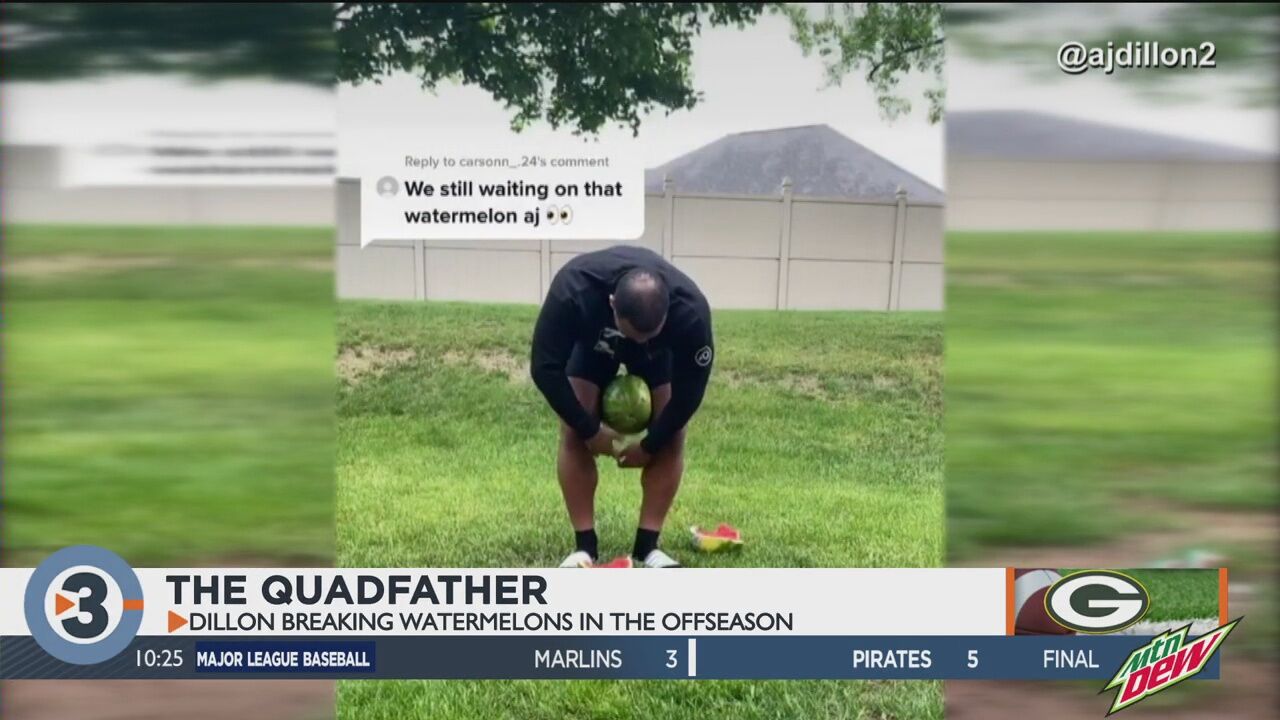 Green Bay Packers' AJ Dillon crushes a watermelon with his legs