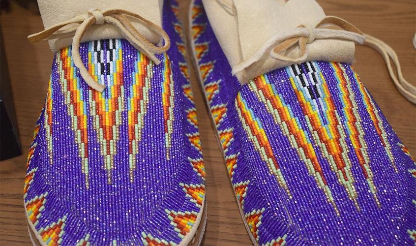 Moccasin making class educates attendees on heart health