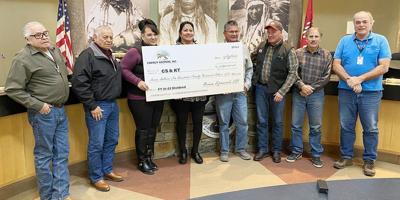 EKI CEO Brian Lipscomb presents the Tribal Council with a dividend check