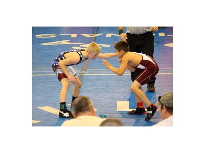 Wrestling proves therapeutic for student, coach News