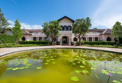 House_of_Tin_Baron_Reflective_Pond_at_the_Main_Entrance_Daytime_1