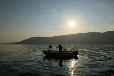 Fisherman Viktor Kocaj hauls in his net early in the morning in Albania's Vlore Bay