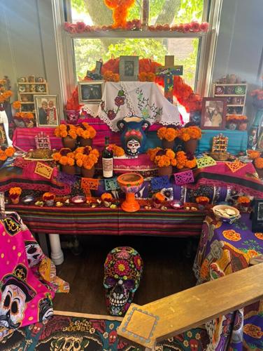 The ofrenda, sharing and honoring photos of lost loved ones. (Photo by Chef Art Smith)