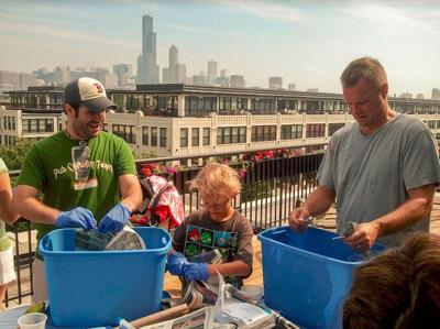 Chicago Conservation Corps members create compost boxes. (Photo courtesy of Chicago Academy of Sciences / Peggy Notebaert Nature Museum)