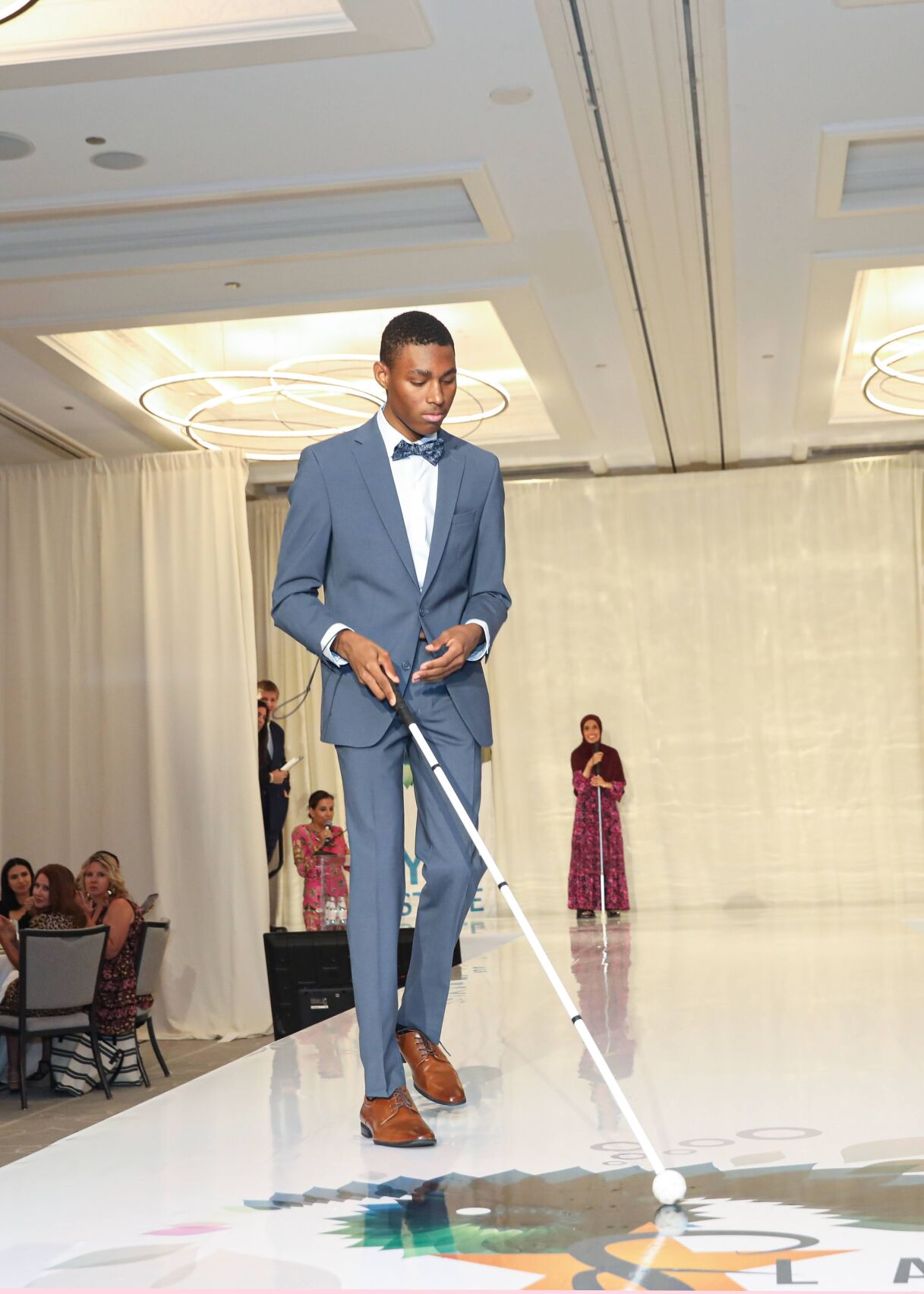 Coryon Copeland, on the runway representing Lighthouse's Youth Transition Program wearing Macy's in the finale. (Mila Samokhina photo)
