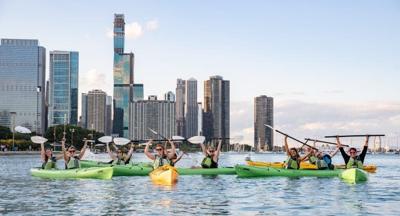 Raise your paddles, kayaking is back at the Riverwalk! (Photo courtesy of Urban Kayaks)