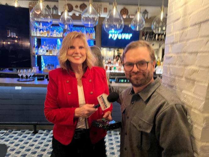 WBBM- Newsradio's Lisa Fielding interviewing David Mossop, the Flyover attraction's film writer/director. (Photo by Candace Jordan)