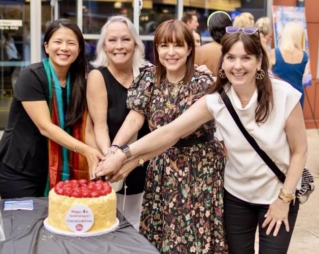 Cutting the Eli's Cheesecake with Elaine Hyde, Candace Jordan, Maureen Schulman and Amanda Puck. (Photo by Kelsy Goodwin)