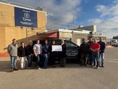 Feonix - Mobility Rising and Tyson Foods representatives celebrating the award.