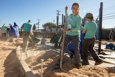 Volunteers build the new playground, creating a welcoming environment where children and teens can thrive, connect, and build brighter futures. (CNW Group/The Independent Order of Foresters) (CNW Group/The Independent Order of Foresters)
