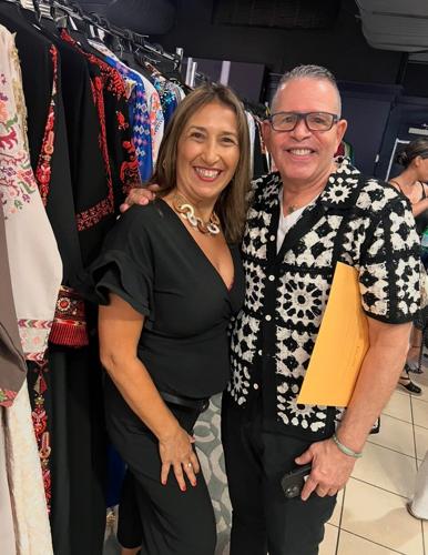 Cesar Rolon backstage before the show with a designer. Rolon has a long, illustrious history in fashion. He was founder of Latino Fashion Week and now World Fashion Festival. His reach is global and his discovery of emerging designers is renowned. (Cand...