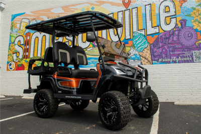 Local Artist Transforms Golf Carts into Rolling Canvases