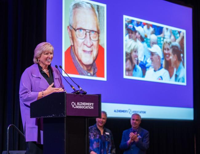 Marty Wilke receives Power of a Champion award at the Alzheimer's Association's Power of Purple: A Reason to Hope luncheon. (Angela B. Garbot photo)
