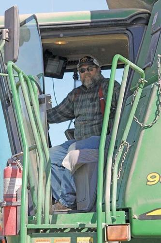 Jerry Dove harvests corn field in Iowa